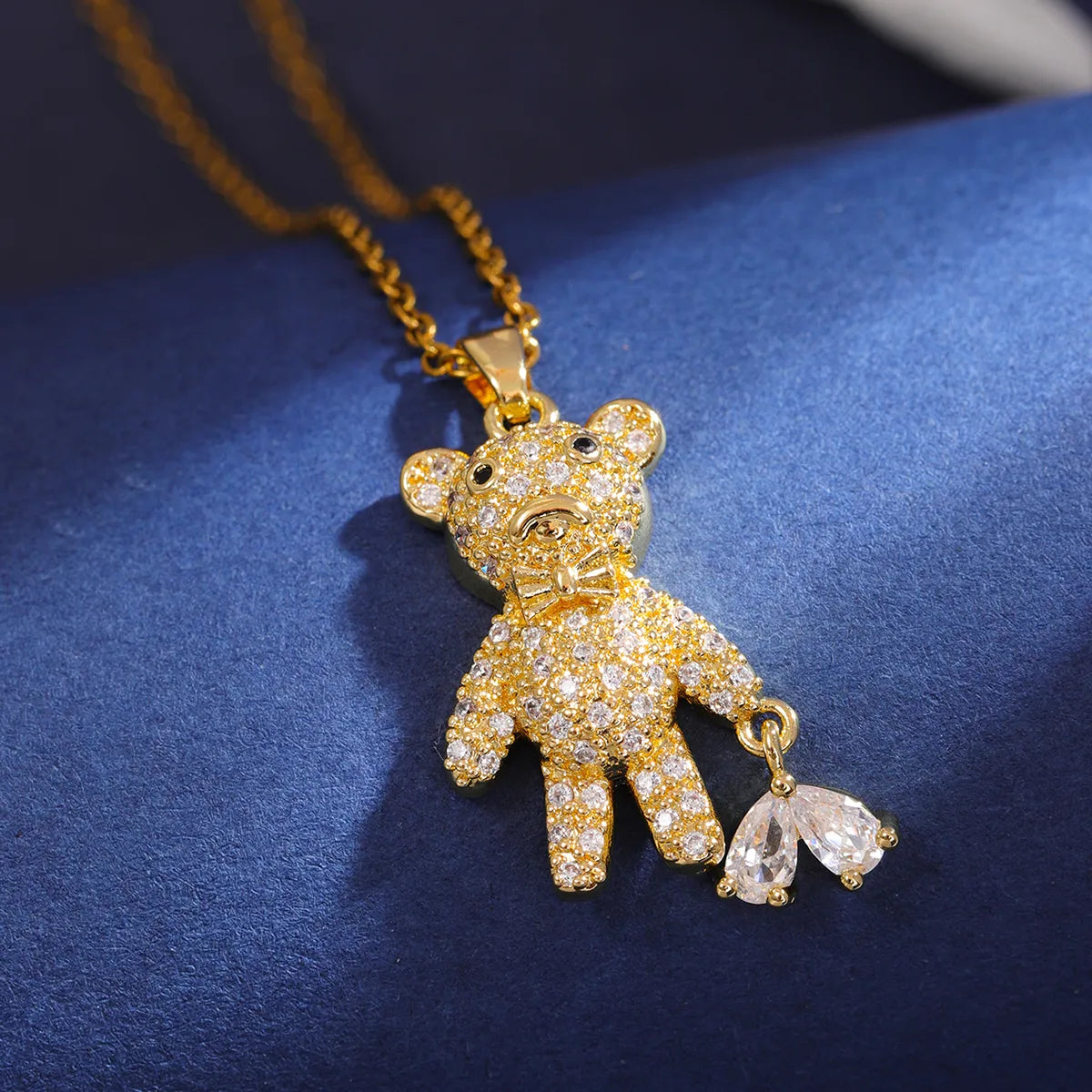 Gold Heart Pulling Bear Pendant