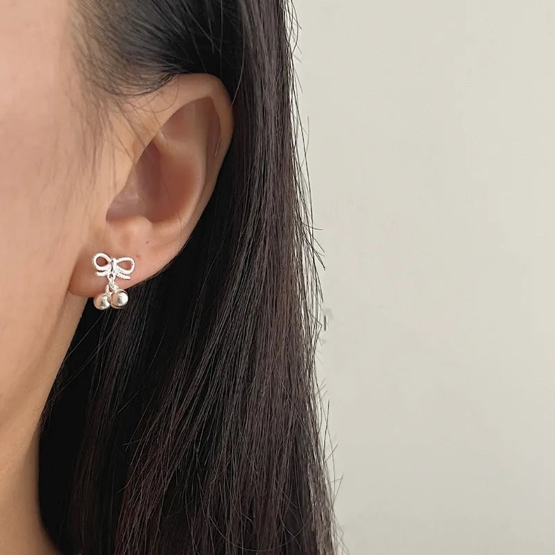 Silver bow bell studs