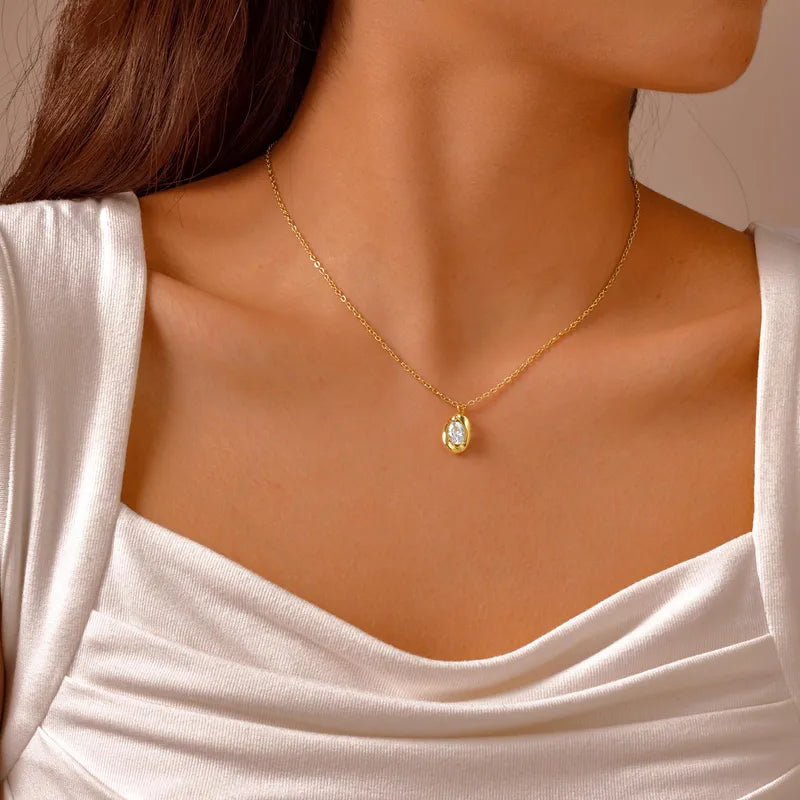 Gold egg pendant set